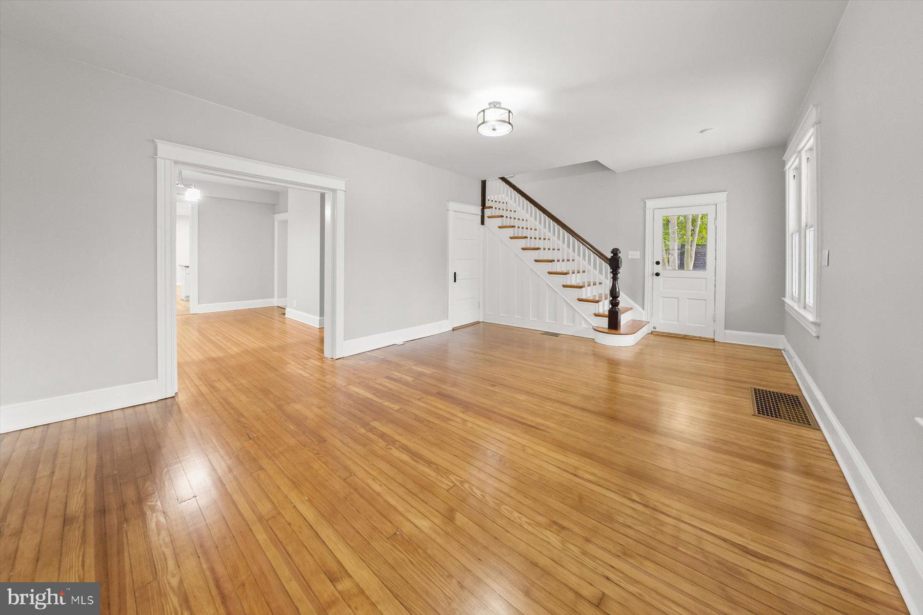 10220 Capitol View Avenue Silver Spring, MD 20910 - Photo 5 of 66 a view of empty room with wooden floor and fan