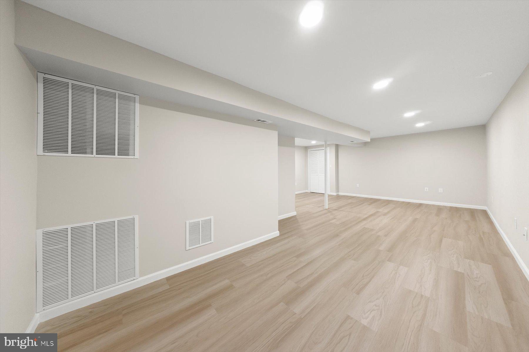 10220 Capitol View Avenue Silver Spring, MD 20910 - Photo 56 of 66 a view of an empty room with wooden floor and a window