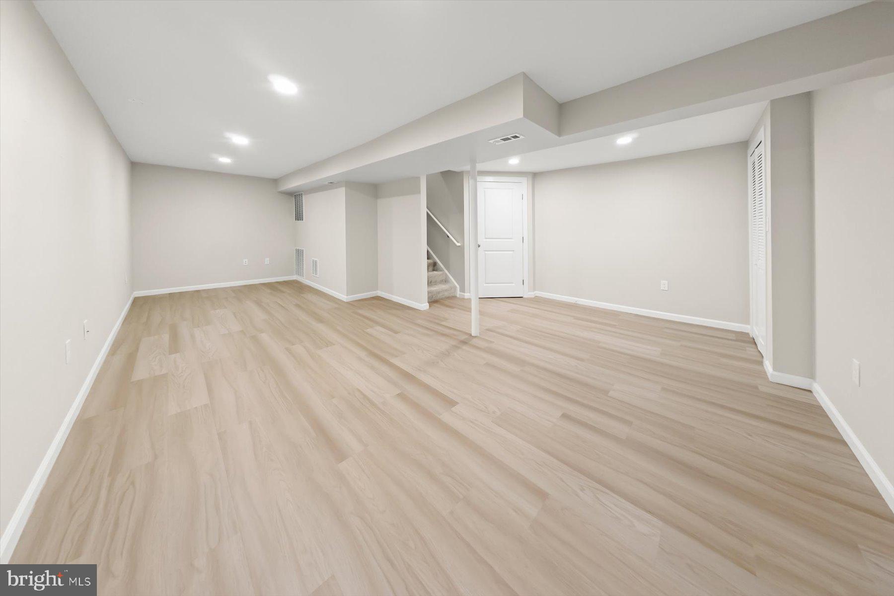 10220 Capitol View Avenue Silver Spring, MD 20910 - Photo 59 of 66 an empty room with wooden floor and windows