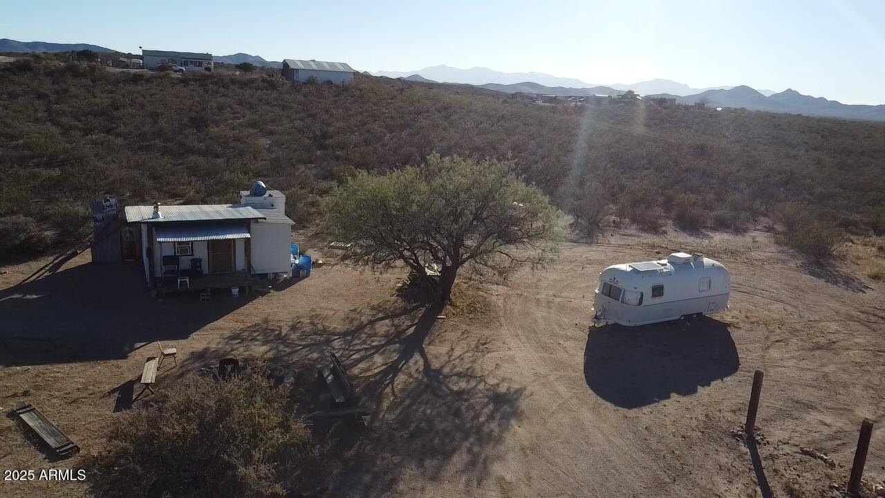 87 East Desert Meadow Road Tombstone, AZ 85638 - Photo 12 of 17 a view of a house with a mountain