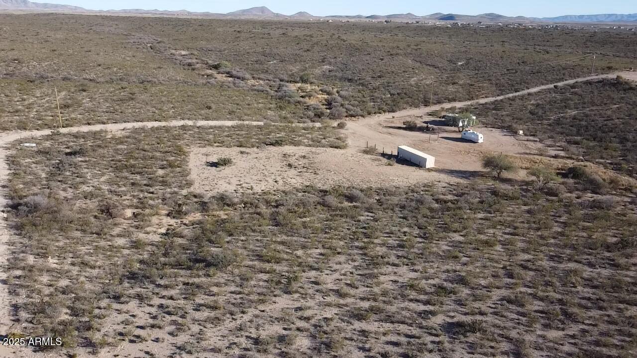 87 East Desert Meadow Road Tombstone, AZ 85638 - Photo 14 of 17 a view of aerial view of residential house and mountain view