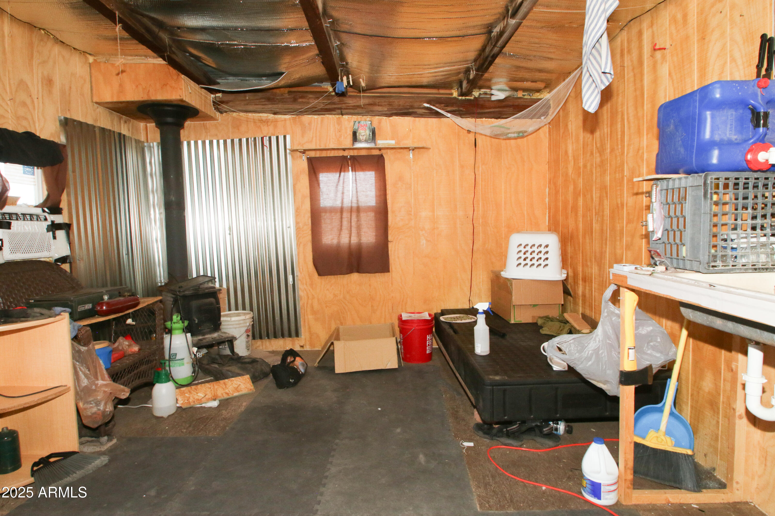 87 East Desert Meadow Road Tombstone, AZ 85638 - Photo 17 of 17 a living room with furniture and a chandelier