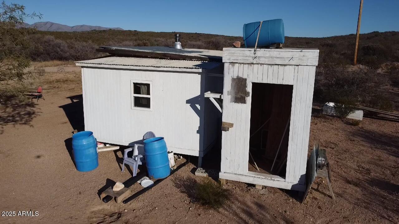 87 East Desert Meadow Road Tombstone, AZ 85638 - Photo 4 of 17 a view of kitchen with furniture and a fireplace