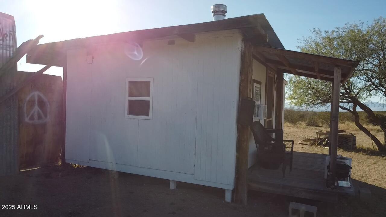 87 East Desert Meadow Road Tombstone, AZ 85638 - Photo 6 of 17 a front view of a house with a yard