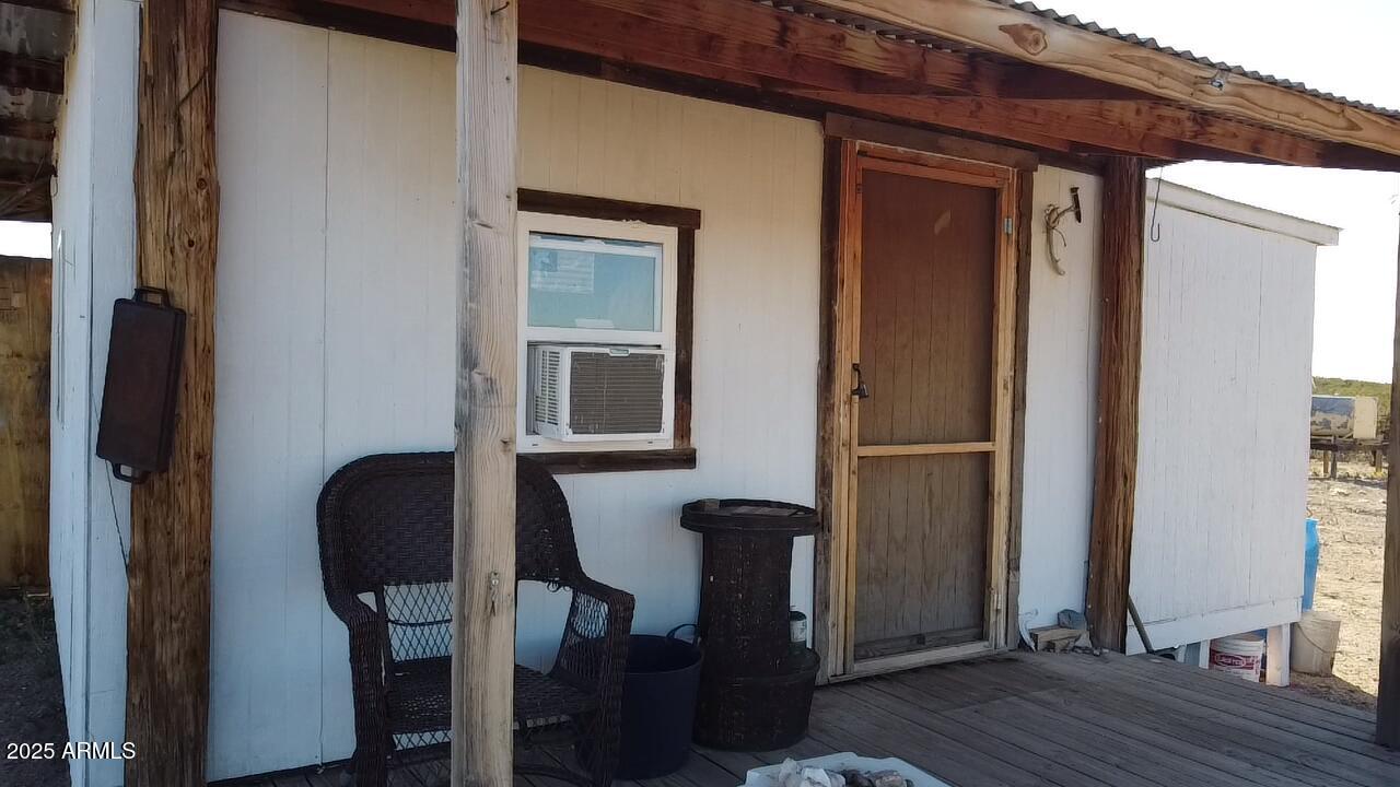 87 East Desert Meadow Road Tombstone, AZ 85638 - Photo 9 of 17 a view of a livingroom with furniture and wooden floor