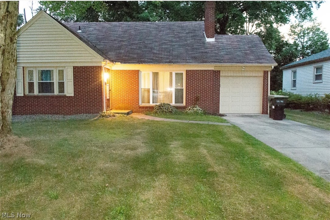 6714 Trenholm Road Youngstown, OH 44512 - Photo 2 of 22 View of front of property featuring a garage and a front yard