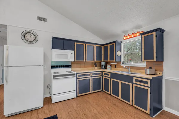 a kitchen with a sink and cabinets