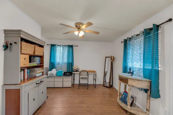 a open kitchen with stainless steel appliances granite countertop a stove and a refrigerator