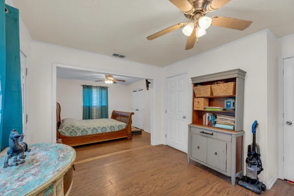 a bedroom with furniture and a chandelier