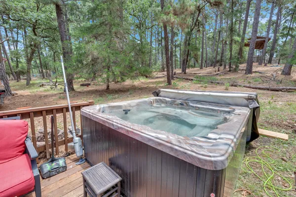 a view of a wooden deck and a backyard