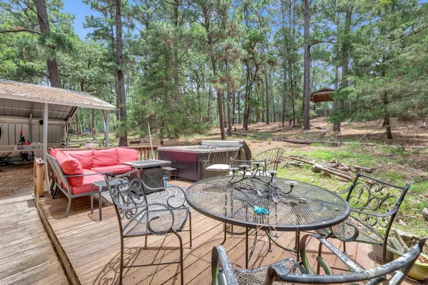 a view of a chairs and table in the patio