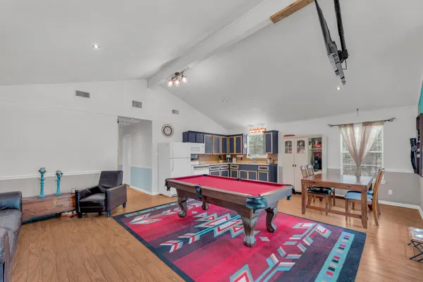 a living room with furniture and a table