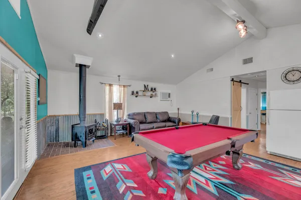 a room with furniture and pool table