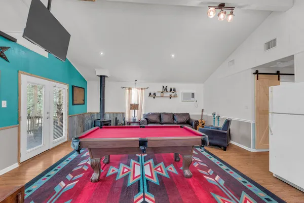 a bedroom with a bed and a table