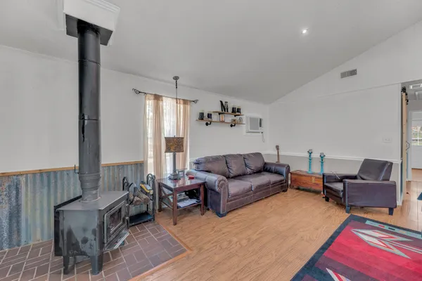 a living room with furniture and a rug