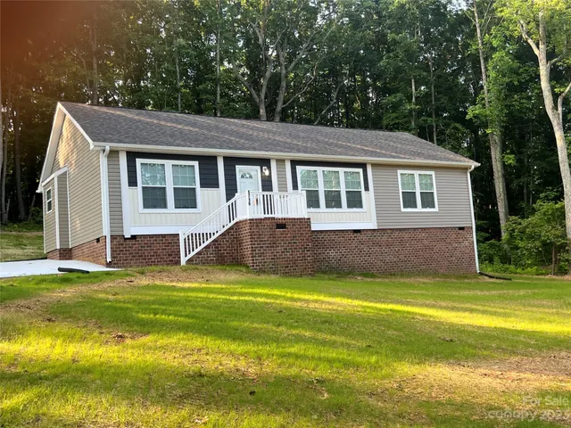 a view of a house with a swimming pool