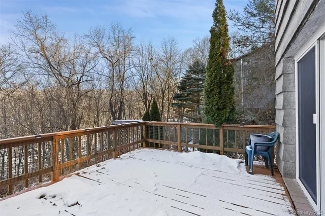 a balcony with wooden floor and fence