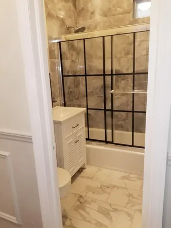 a view of a bathroom with a sink and a window