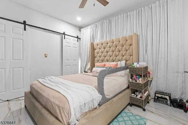 a living room with a flat screen tv and a white door