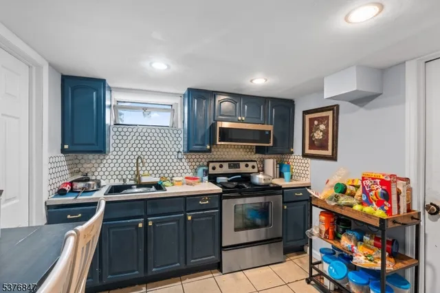 a bathroom with a sink a mirror and a shower
