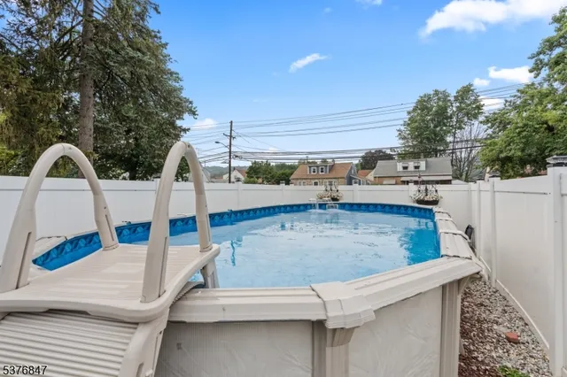 an aerial view of a house with swimming pool
