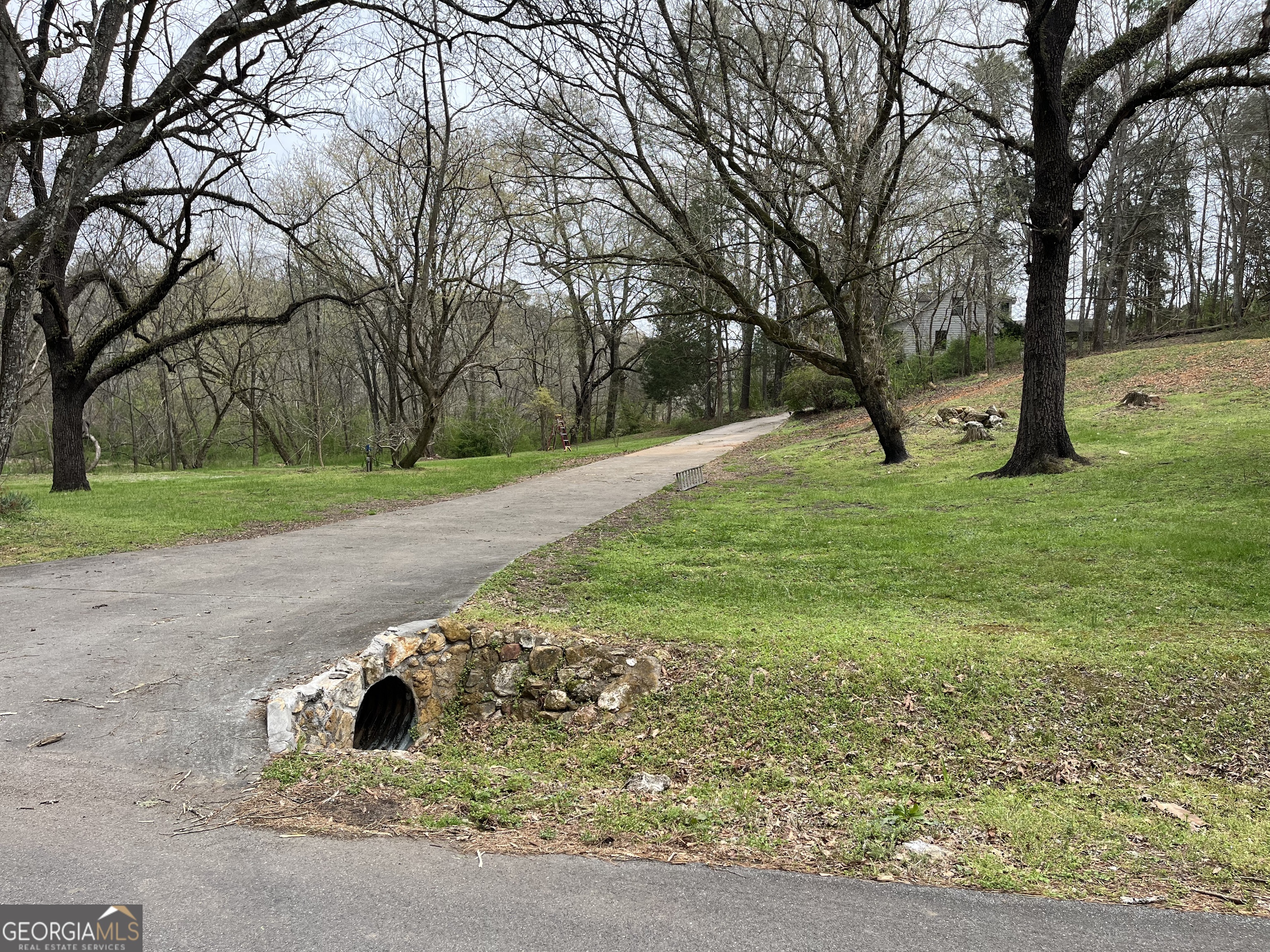 475 Davis Road Southwest Cave Spring, GA 30124 - Photo 4 of 27 a white house with a yard and a large tree