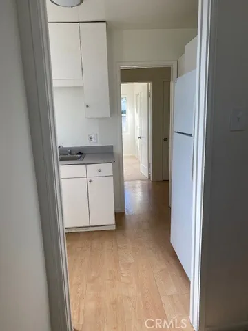 a view of cabinets with wooden floor