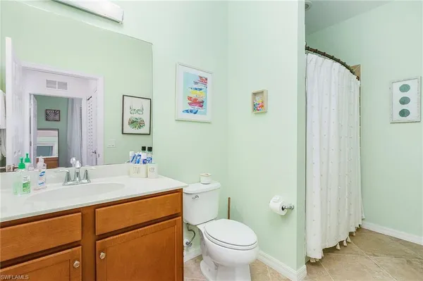 a bedroom with a bed and a table in it