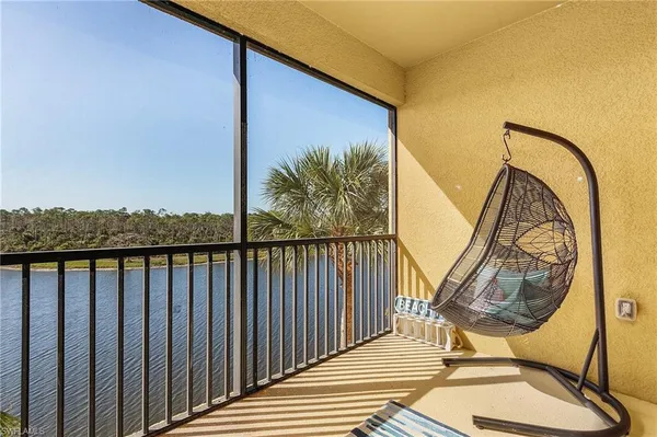 a view of balcony with furniture