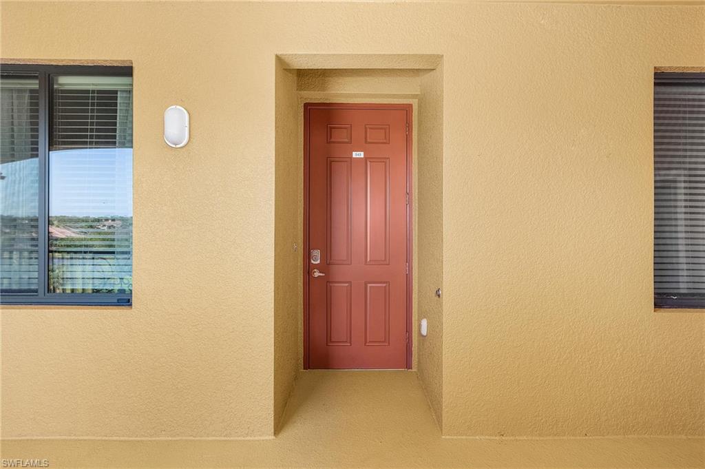 9731 Acqua Court, Unit 543 Naples, FL 34113 - Photo 2 of 24 a view of a door