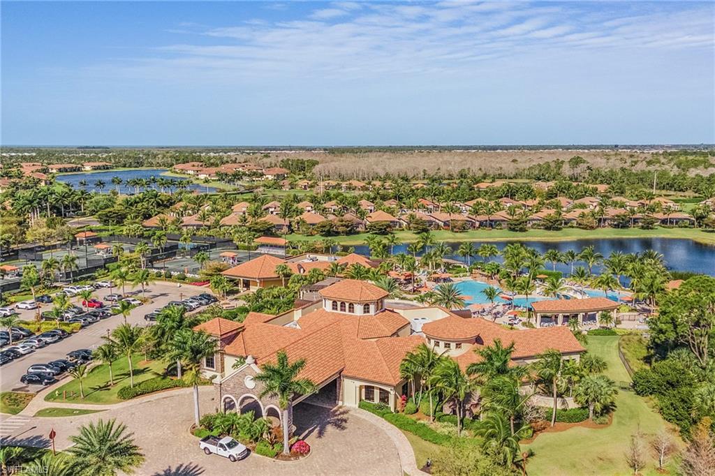 9731 Acqua Court, Unit 543 Naples, FL 34113 - Photo 22 of 24 an aerial view of residential building and lake