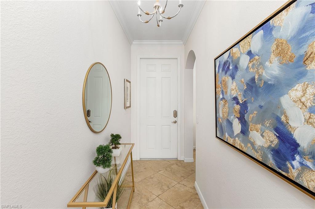 9731 Acqua Court, Unit 543 Naples, FL 34113 - Photo 3 of 24 a view of a hallway with entryway