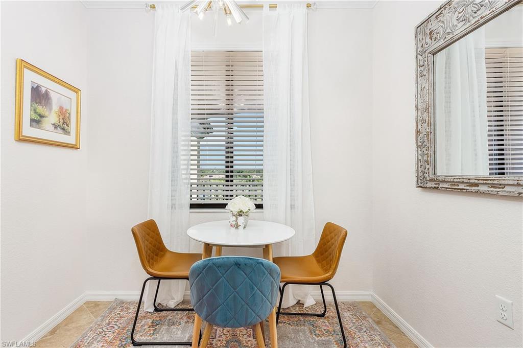 9731 Acqua Court, Unit 543 Naples, FL 34113 - Photo 8 of 24 a view of a dining room with furniture and window