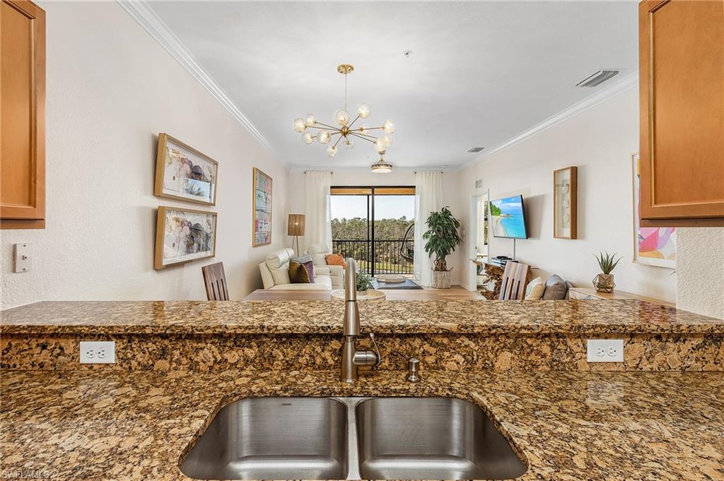 9731 Acqua Court, Unit 543 Naples, FL 34113 - Photo 24 of 24 a kitchen with sink and window