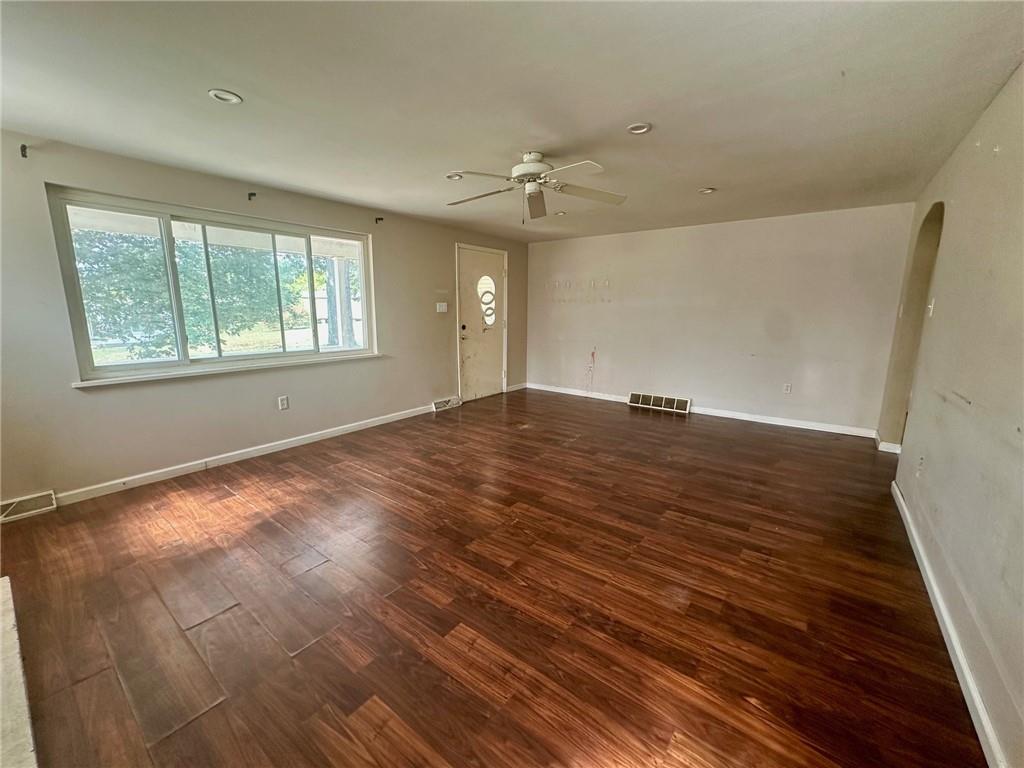467 Big Knob Road Rochester, PA 15074 - Photo 6 of 12 a view of an empty room with wooden floor and a window