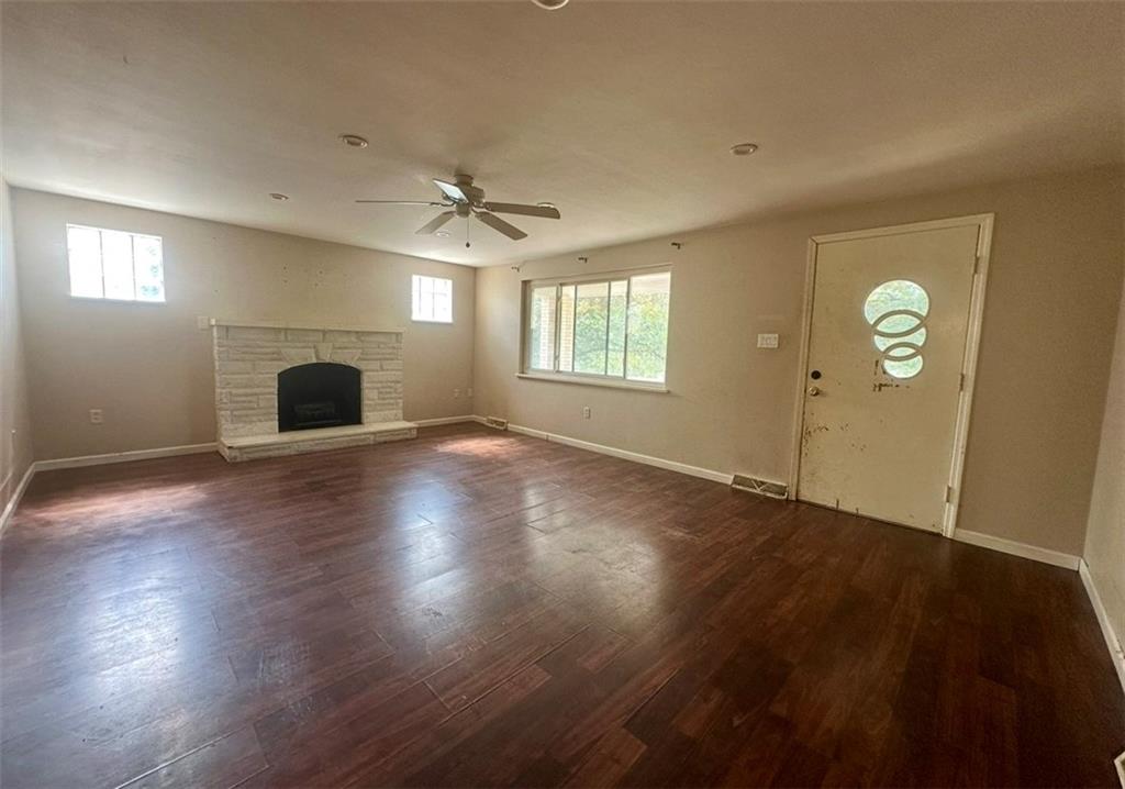 467 Big Knob Road Rochester, PA 15074 - Photo 7 of 12 an empty room with wooden floor chandelier and windows