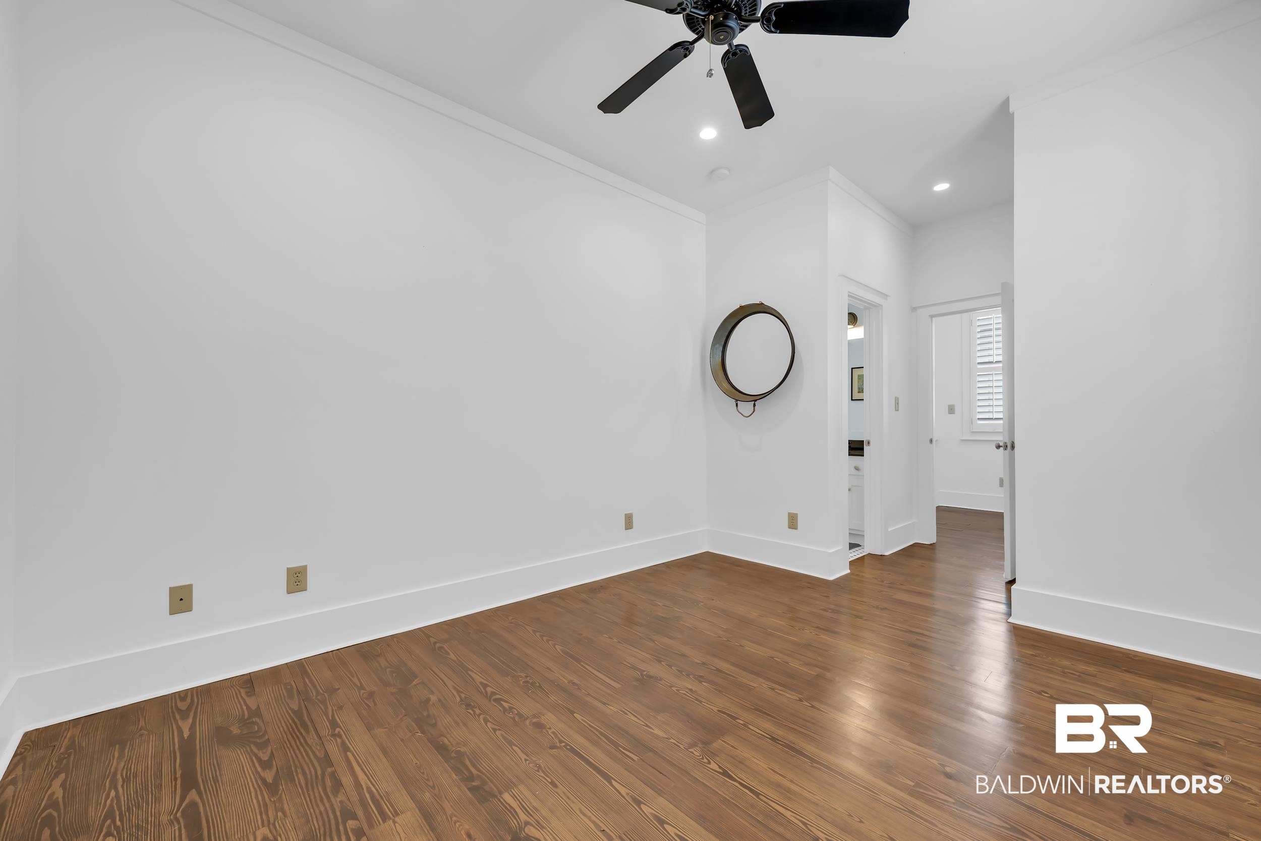 25773 Canal Road, Unit 32 Orange Beach, AL 36561 - Photo 23 of 35 Spare room featuring crown molding, wood finished floors, a ceiling fan, and recessed lighting