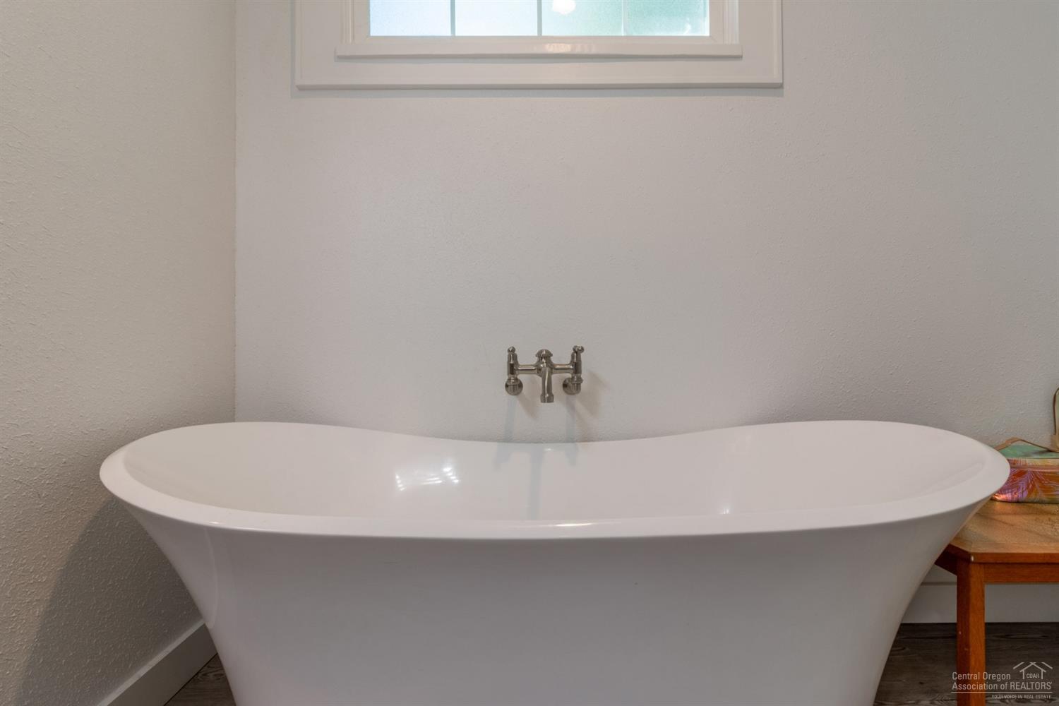 660 Level Lane Springfield, OR 97477 - Photo 6 of 23 a white bath tub sitting in a bathroom