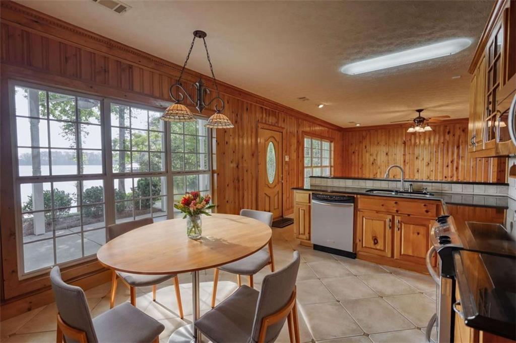 255 Old Hardy Farm Road Jackson, GA 30233 - Photo 30 of 78 a kitchen with a table and chairs in it