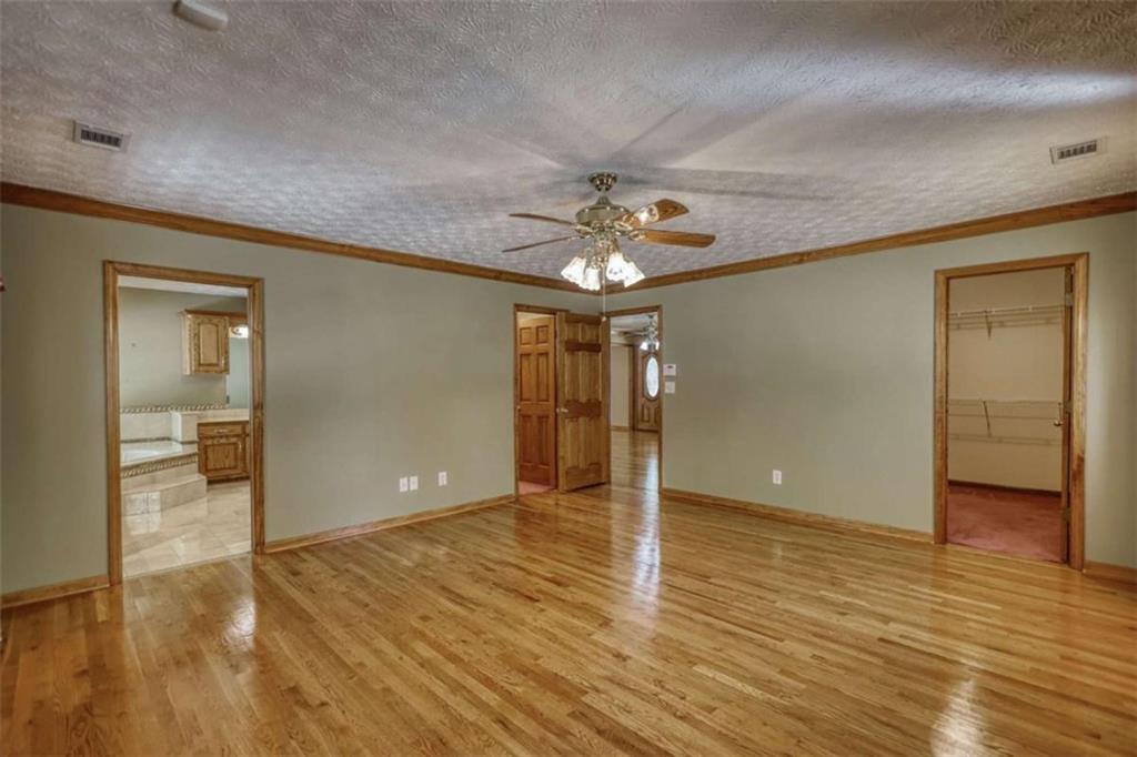 255 Old Hardy Farm Road Jackson, GA 30233 - Photo 48 of 78 a view of an empty room and wooden floor