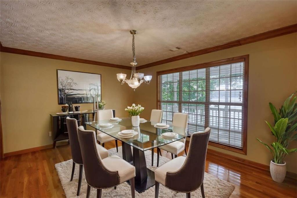 255 Old Hardy Farm Road Jackson, GA 30233 - Photo 58 of 78 a view of a dining room with furniture window and wooden floor