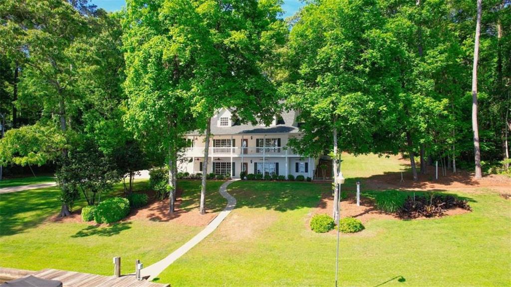 255 Old Hardy Farm Road Jackson, GA 30233 - Photo 6 of 78 a view of a house with a yard patio and fire pit