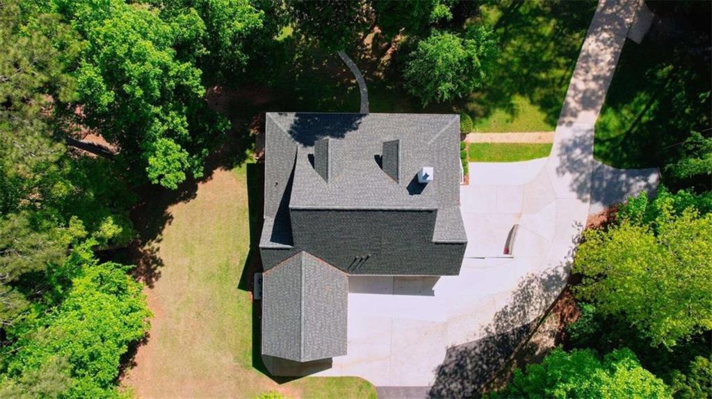 255 Old Hardy Farm Road Jackson, GA 30233 - Photo 70 of 78 an aerial view of a house with swimming pool and large trees