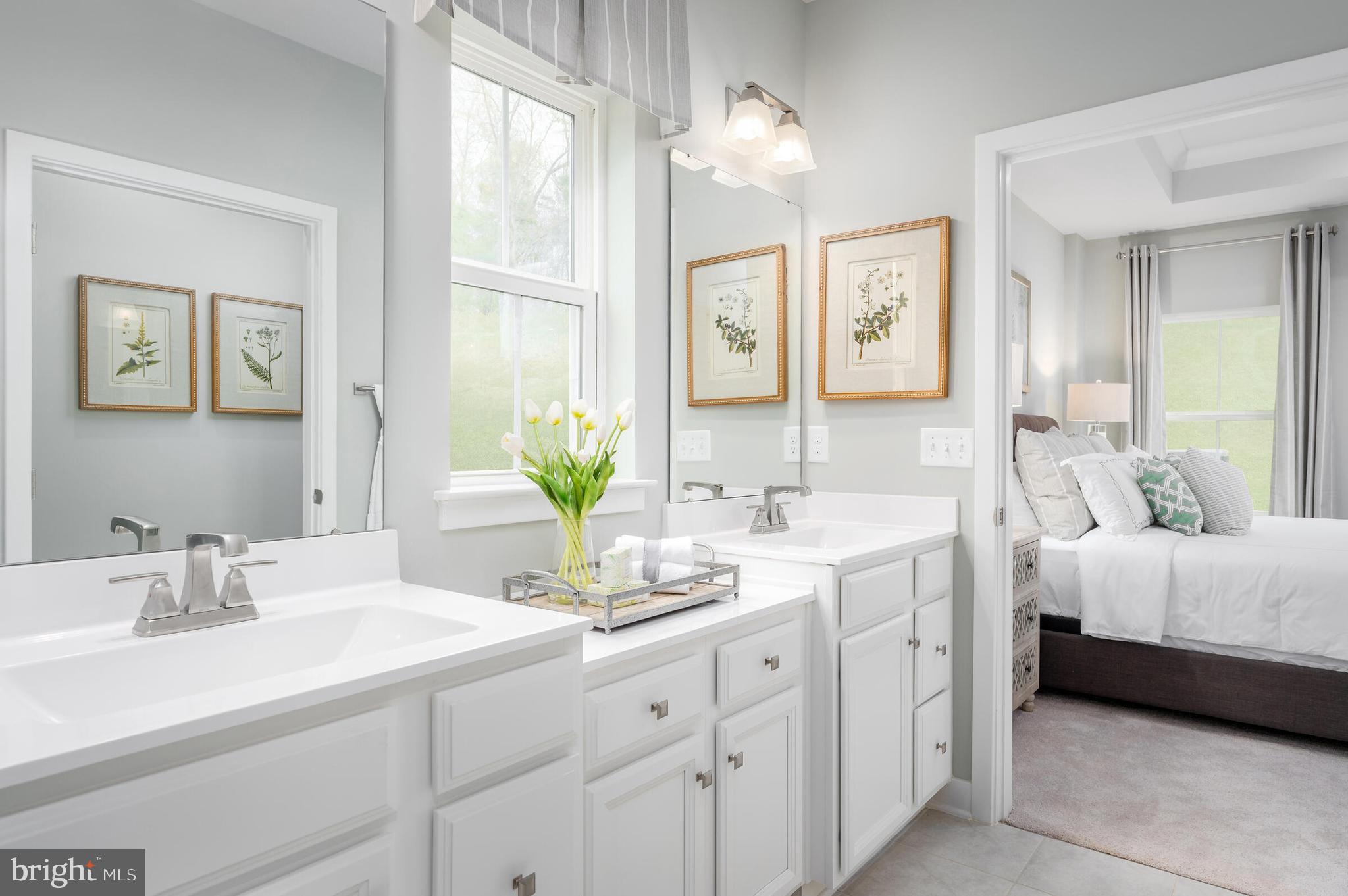 4004 Rudy Drive Sykesville, MD 21784 - Photo 19 of 24 a spacious en suite bathroom with double sink and a mirror