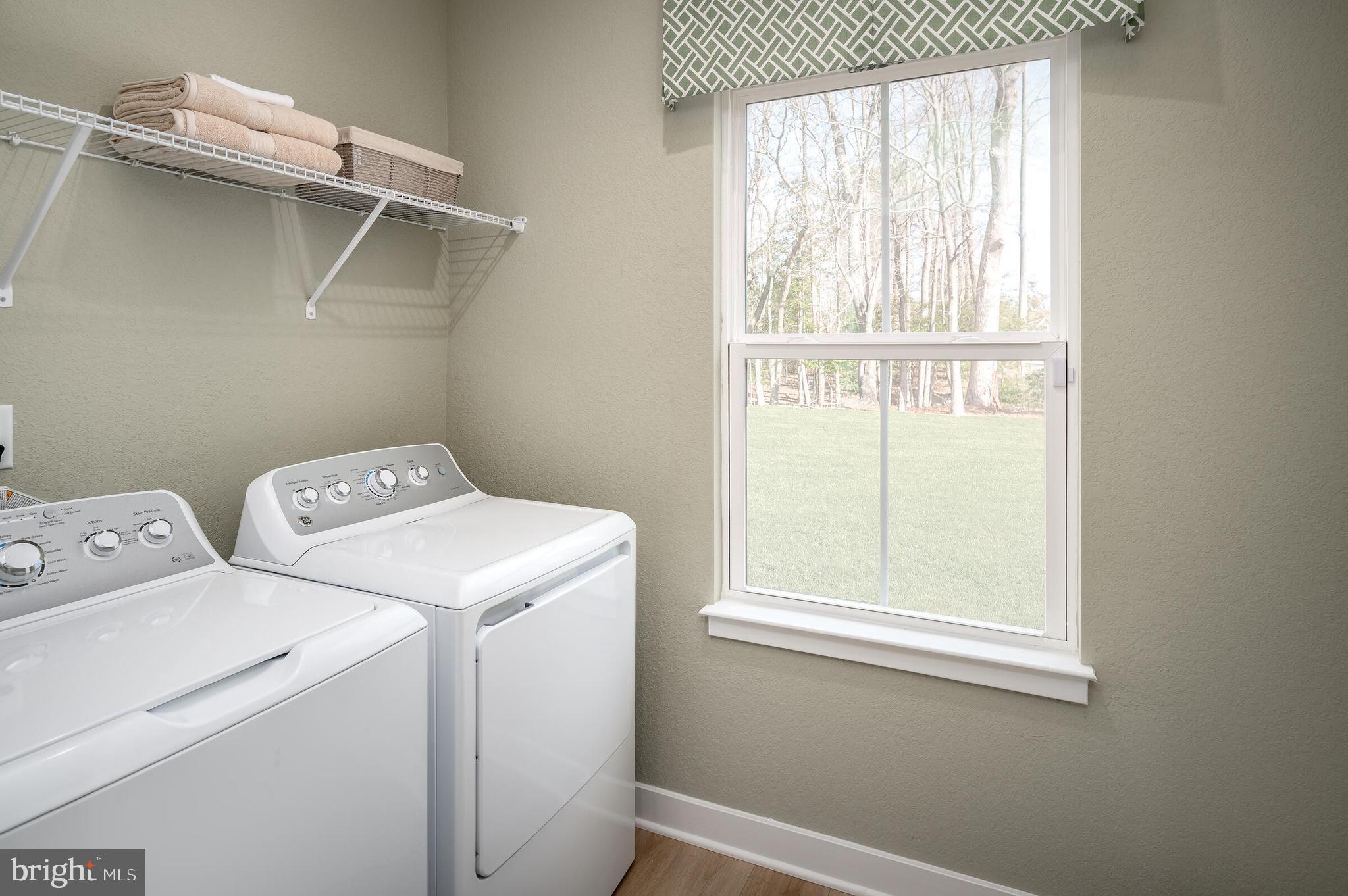 4004 Rudy Drive Sykesville, MD 21784 - Photo 2 of 24 a utility room with dryer and washer