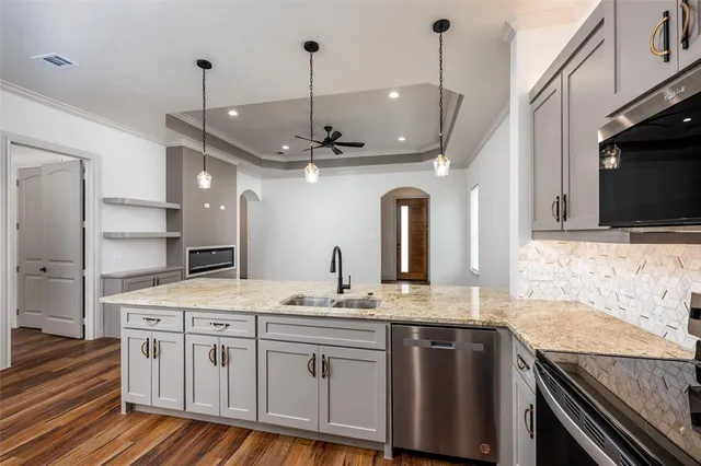 a view of a kitchen cabinets and wooden floor