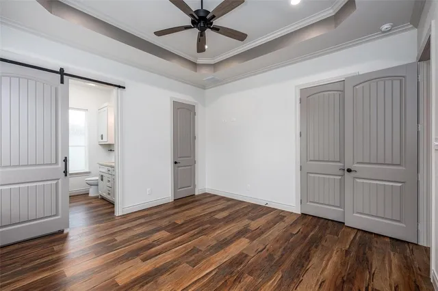 a bathroom with a granite countertop sink toilet and mirror