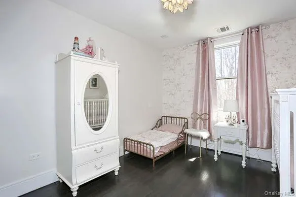 a view of a bedroom with washer and dryer