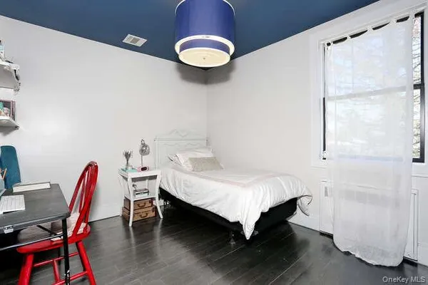 a bedroom with a bed and a table