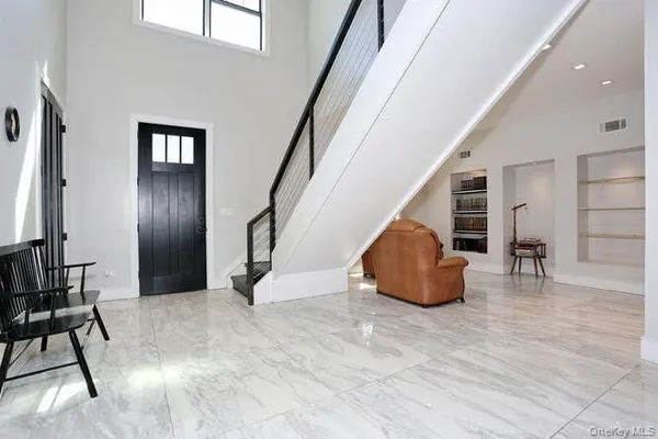 a view of livingroom with furniture and stairs